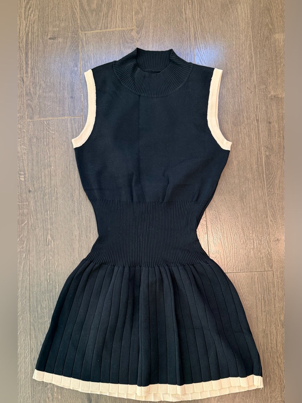 Sleeveless Black Knit Pleated Mini Dress with Cream Trim